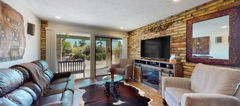 Ground-floor condo with on-site pool, grills, patio, & central AC