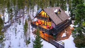 A cabin with a balcony, a deck, and a snow-covered ground. - The Apres Chalet on Peak 7, Private Hot Tub, Locaton & Great Views! (Breckenridge)