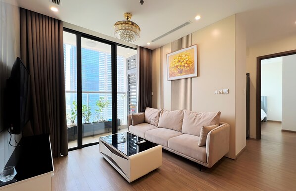 Apartemen Deluks, 2 kamar tidur | Area keluarga | TV layar datar, perapian, Netflix, dan pemutar DVD