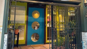 A storefront with a sign reading "CHOMM HOUSE". - Chomm House (Bangkok)
