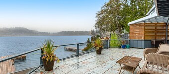 Lakefront home with canoe, kayaks, large deck, beach access, fireplace, & W/D