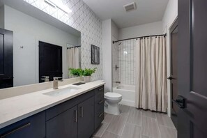 Shower, hair dryer, towels, shampoo