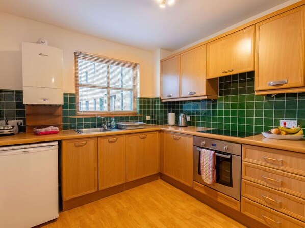Fridge, microwave, oven, cookware/dishes/utensils