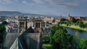 A historic cityscape with prominent architecture, including a castle and a cathedral. - Miller Heights by Interhome (Inverness)