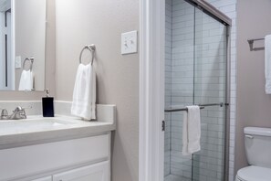 Shower, eco-friendly toiletries, hair dryer, towels