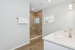 Shower, hair dryer, towels, shampoo