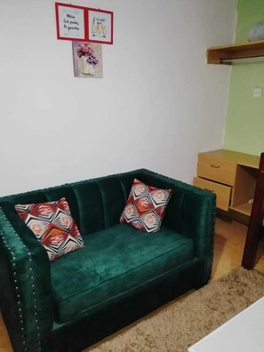 Business Studio | Living area | 24-inch Smart TV with digital channels - Lux Suites Lumumba  Studio Apartments (Nairobi)