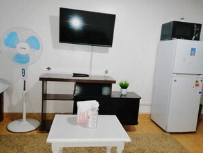 Business Studio | Living area | 24-inch Smart TV with digital channels