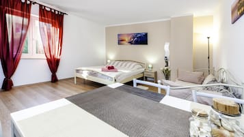 Studio | Living area | 60-cm flat-screen TV with satellite channels
