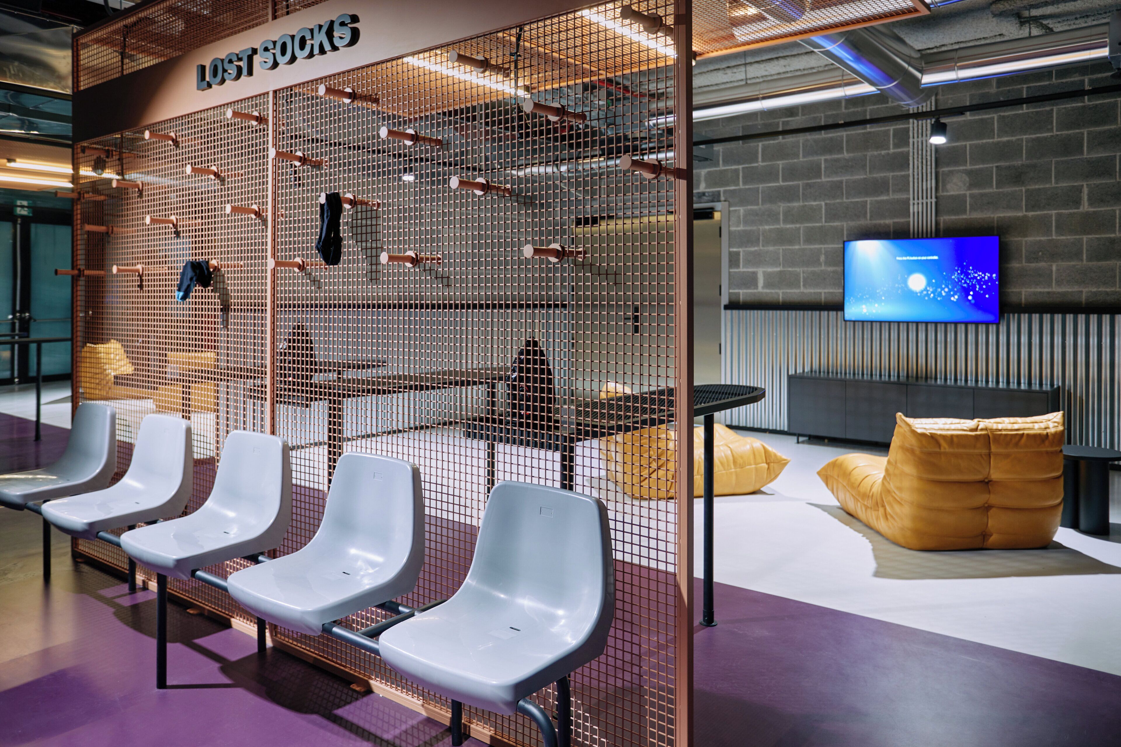 A seating area with white chairs and a 'LOST SOCKS' sign.