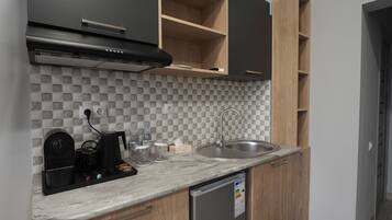 Studio with Balcony | Minibar, desk, laptop workspace, iron/ironing board (on request)