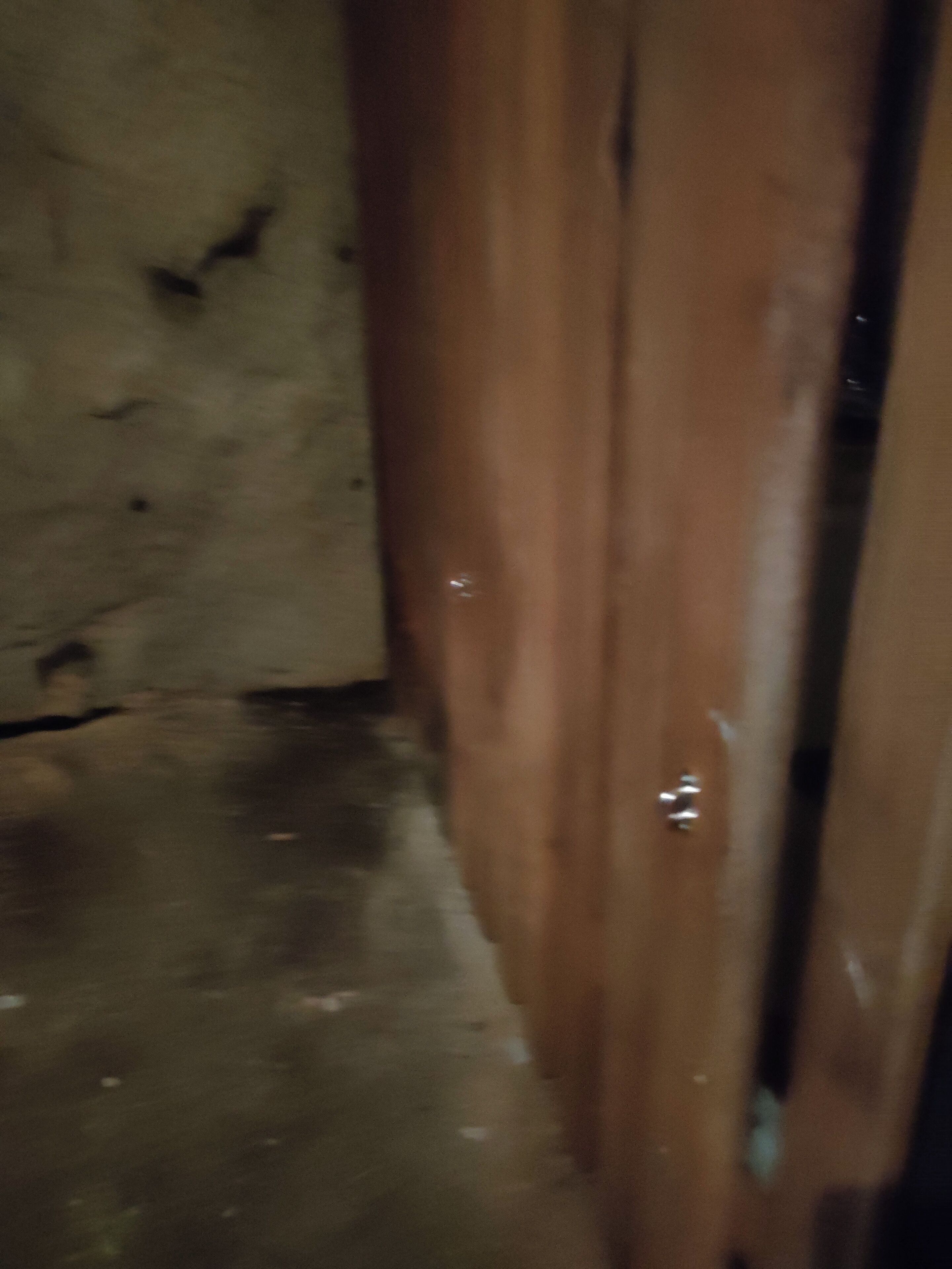 A wooden door with visible wear and a metal handle.