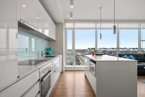 Fridge, microwave, oven, stovetop - Downtown 2BR | Mountain Views • Free Parking • Banff Pass + Wine! (Calgary)