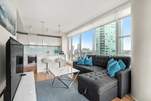 TV, offices - Downtown 2BR | Mountain Views • Free Parking • Banff Pass + Wine! (Calgary)