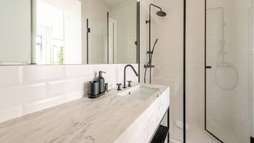 Shower, hair dryer, towels, soap
