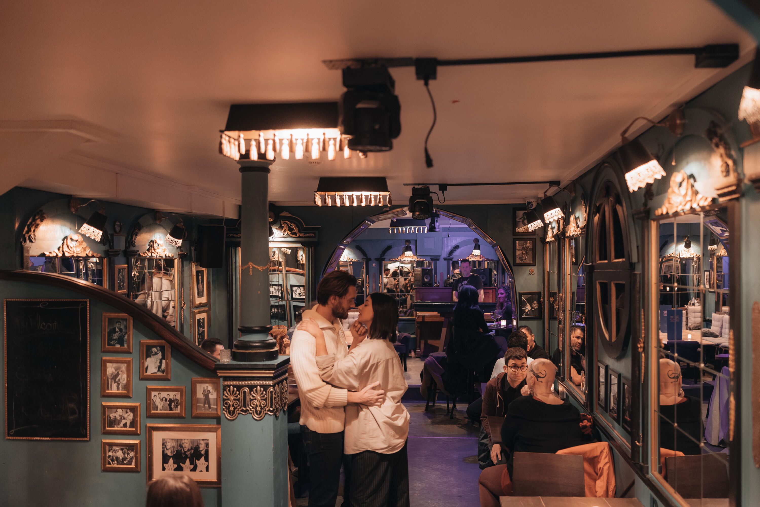 A cozy, vintage-themed bar with ornate decorations and a warm, inviting atmosphere.