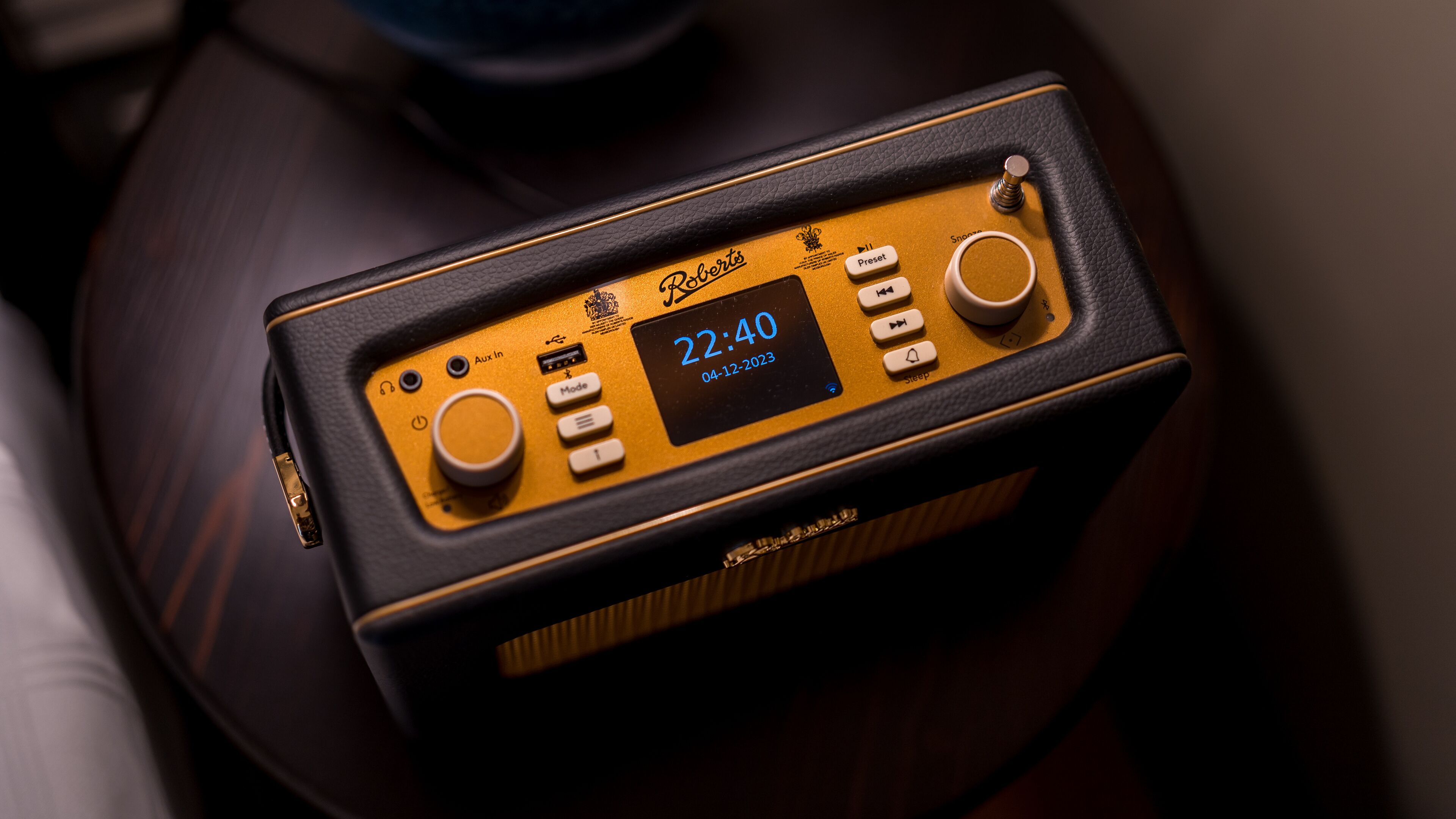 A portable music player with a display showing the time and date.