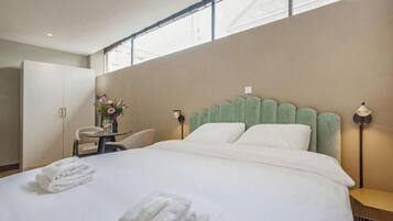 Deluxe Apartment | Hypo-allergenic bedding, down comforters, in-room safe