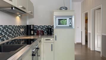 Kondominium | Dapur pribadi | Lemari es, microwave, oven, dan kompor