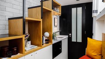 Basic Studio, 1 Large Twin Bed | Private kitchen | Mini-fridge, microwave, stovetop, toaster