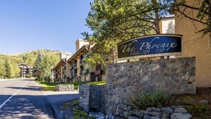 A hotel sign with "The Phoenix 207-250" indicating the address. - Phoenix 207 2 Bedroom Condo by RedAwning (Steamboat Springs)