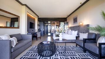 Luxury Studio | Living area | 32-inch flat-screen TV with cable channels, Netflix, streaming services