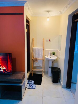 Business Apartment | Living area | 24-inch Smart TV with digital channels