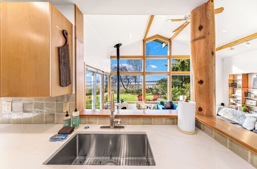 Luxe Waterfront Haven: 3BR Vaulted-Ceiling Home w/ Scenic Ocean & Sunset Views