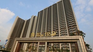 A high-rise building with multiple balconies and a prominent sign reading "Sky House B&L". - Sky House BSD by Kakarama Room (Pagedangan)