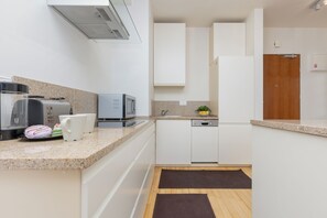 Apartment, 1 Bedroom, Kitchen | Private kitchen | Microwave, dishwasher, cookware/dishes/utensils - Apartment for Four in Warsaw by Renters (Warsaw)