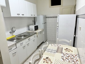 Fridge, microwave, toaster, cookware/dishes/utensils