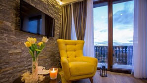 Deluxe Apartment, Terrace, Mountain View | Living area | 32-inch Smart TV with cable channels, heated floors - SREBRNA PLANINA Spa & Resort (Raška)
