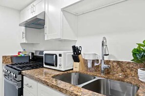 Fridge, microwave, stovetop, coffee/tea maker