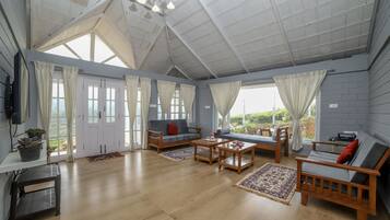 Deluxe Villa | Living area | Fireplace