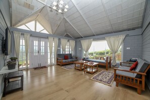 Deluxe-Villa | Wohnbereich | Kamin