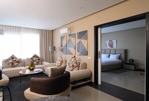 Junior Suite | Living area | 43-inch Smart TV with cable channels