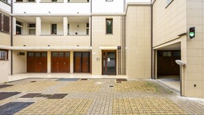 A multi-story residential building with a courtyard. - Berni - One Bedroom Apartment, Sleeps 2 (Florence)