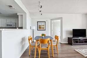 Comfort Apartment | Living area | 70-inch TV with digital channels
