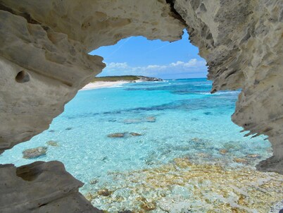 Beachfront family home steps from the perfect secluded ocean beach. 