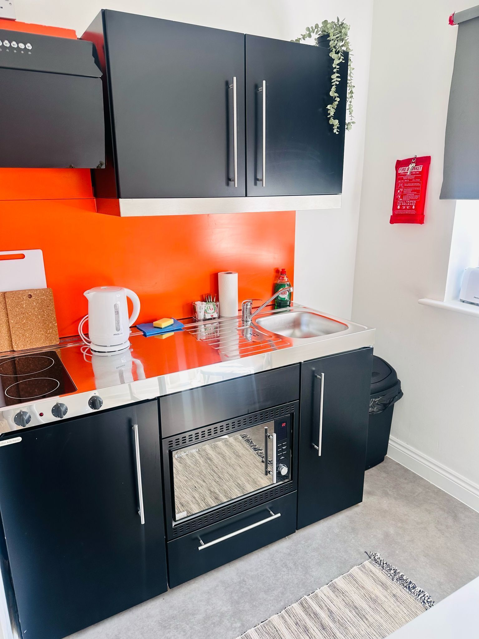 Fridge, microwave, stovetop, dining tables