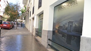 A street view with a building labeled 'DEBOD HOSTEL'. - DEBOD HOSTEL (Madrid)