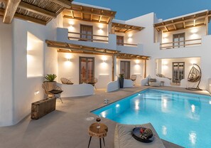 A modern villa with a pool, wooden pergolas, and outdoor seating. - Naxos Contelibro (Naxos)
