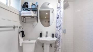 Shower, hair dryer, towels, soap