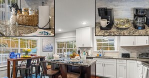 A modern kitchen with white cabinets, a granite countertop, and a coffee maker. There is a dining area with a table and chairs, and a window with a view of the neighborhood. - 3min walk to private beach access, saltwater spa & pool (Destin)