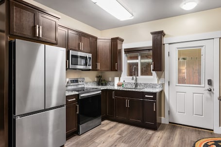 Apartment | Private kitchen | Full-size fridge, microwave, oven, stovetop