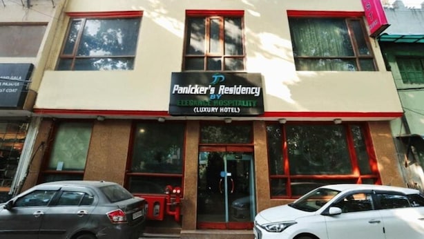 A building with a sign for 'Panicker's Residency' indicating it is a luxury hotel. - Hotel Panickers Residency (New Delhi)