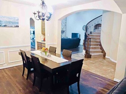 Spacious 6-bedroom house with pool and hot tub and theater room next to stadium!