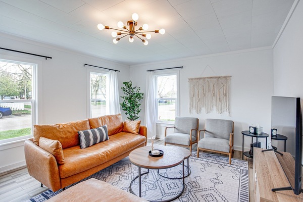 Inviting living room features a 55 inch samsung smart tv.