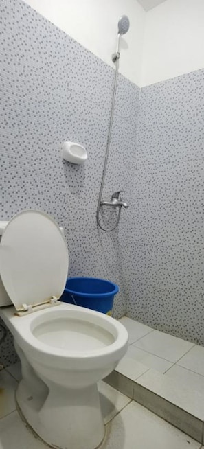 Habitación Deluxe | Baño | Regadera y toallas