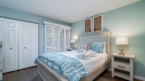 A bedroom with a bed, nightstands, a dresser, and a closet. - 2 BR/2BA Courtside Villa! Amenity access NOT available Dog Friendly!Tennis Court Views! (Seabrook Island)